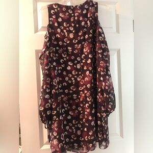 Never worn without tags. Cold shoulder see through long sleeves